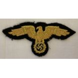 A reproduction WWII style German diplomatic officials gold bullion cap eagle cloth badge.