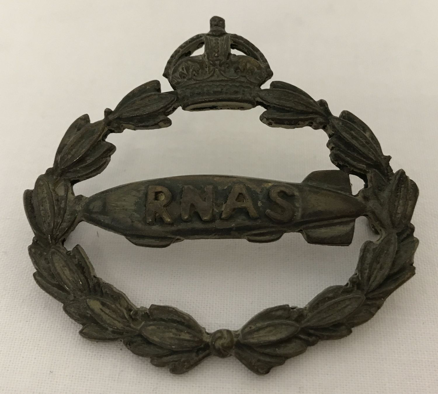 A British WWI style Royal Naval Air Service cap badge.