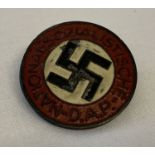 A German WWII style ersatz (economy issue) N.S.D.A.P. pin back badge.
