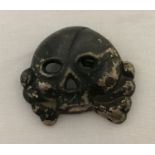 A German WWII style Allgemeine SS Totenkopf skull badge - jawless type.