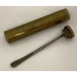 A vintage brass Lee Enfield oil bottle with screw top, internal wand and bowed base.