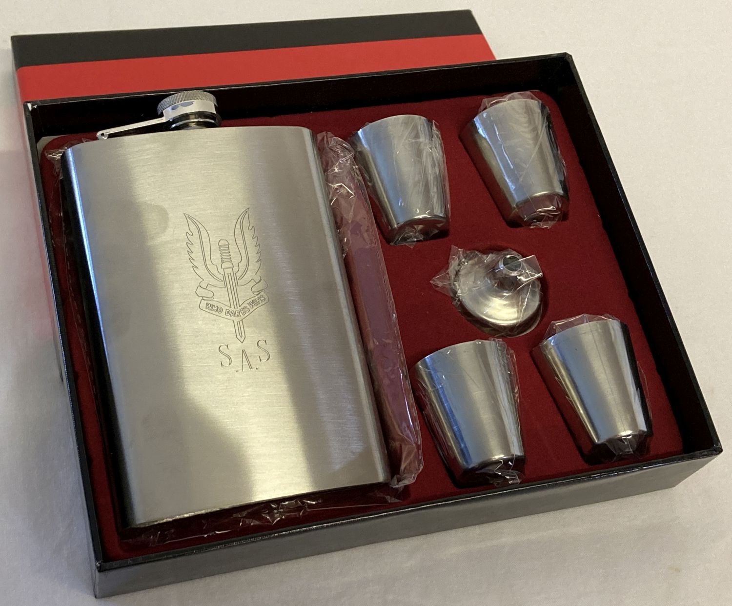 A new and boxed hip flask and shot cups set with S.A.S engraved insignia detail.