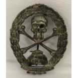 A Spanish Civil War style Austrian Storm Troops Tank Brigade pin back badge.