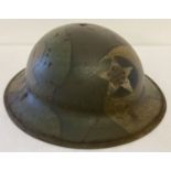 A WWI style US 2nd Infantry Doughboys helmet (no liner) with hand painted jigsaw pattern camouflage.