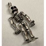 A 925 silver pendant in the shape of an articulated skeleton.