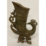 A Chinese bronze archaic style vase in the shape of a mythical creature.