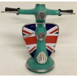 A novelty table lamp in the shape of the handlebars of a Vespa scooter, with Union Jack design.