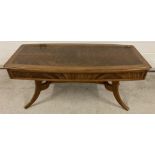 A vintage design solid wood coffee table with front drawer, by Nathan.