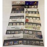 A collection of 12 Royal Mail postage stamp collectors presentation packs.