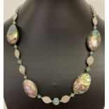 An 18" costume jewellery necklace with abalone shell, green aventurine and white metal beads.