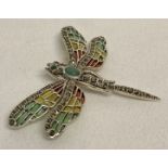 A 925 silver dragonfly brooch with coloured translucent enamelled wings and marcasite detail.