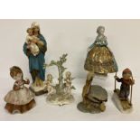 A collection of vintage ceramic figurines to include Dresden and Goebel Hummel.