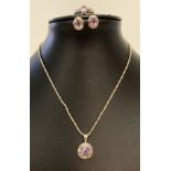 A modern design silver necklace set with amethyst, together with matching earrings & ring.