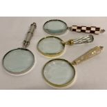 A collection of 4 large magnifying glasses.