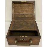 A small vintage wooden writing box with lift down compartment and metal carry handle.
