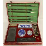 A boxed Chinese calligraphy set to include ceramic, soapstone and slate items.