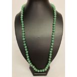 A 26" Chinese jade beaded necklace, knotted between each bead.
