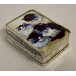 A small silver pill box with ceramic plaque set to hinged lid, depicting kittens.