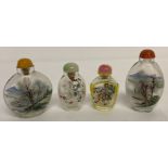A collection of 4 Oriental interior painted glass snuff bottles.