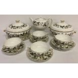 A collection of assorted first quality Wedgwood dinner and tea ware in "Strawberry Hill" pattern.