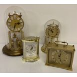 4 vintage brass and brass effect clocks. 2 clear domed swinging pendulum clocks.