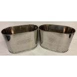 A pair of large Bollinger Champagne buckets with engraved details to sides.