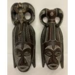 A pair of wooden tribal carved and painted wall hanging masks a/f.