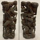 A tribal wooden carving of a mother and her children.