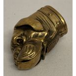 A brass vesta case in the shape of a bulldog's head.