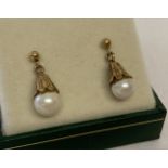 A pair of 9ct gold decorative bell shaped drop earrings set with white pearls.