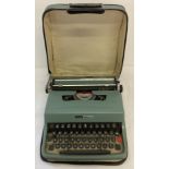 A vintage Olivetti Lettera 32 typewriter complete with carry case.