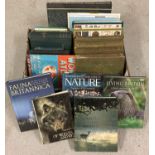 A box of antique, vintage and modern books relating to natural history.