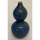 A Chinese ceramic bottle gourd shaped water dropper with blue glaze.