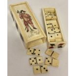 A carved bone miniature domino set with sliding drawer compartment.