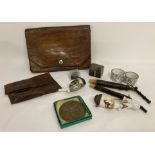 A small collection of vintage items to include ceramic pipes and pipe bowls, leather clutch bag and