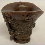 A carved Chinese libation cup with Mythical Creature detail and signature to base.