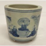 A hand painted blue and white Chinese ceramic brush pot.