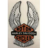 A painted cast iron Harley Davidson wall plaque, with fixing holes.
