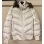 A women's padded down jacket with detachable hood by Japanese company Uniqlo.
