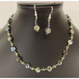 A 16" abalone shell, hematite and green glass beaded necklace with matching earrings.