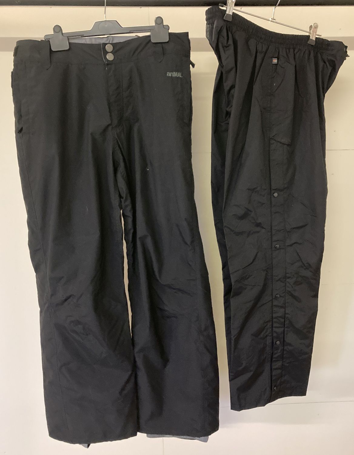 2 pairs of black outdoor activity/ski trousers.