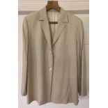 A fully lined summer weight beige single breast ladies jacket by Burberry.