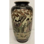 A large oriental black and gold satsuma ceramic vase with panel decoration.