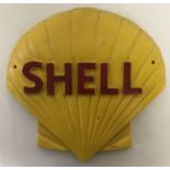 A large convex painted cast iron wall hanging advertising plaque for Shell.