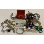 A small collection of vintage and modern costume jewellery.