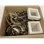 A box of mixed vintage and modern costume jewellery to include bracelets, bangles and necklaces.