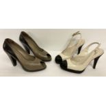 2 pairs of women's designer leather shoes.