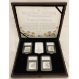 A Limited Edition Beatrix Potter stamp and coin wooden presentation box, limited to 495 pieces.