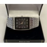 A men's stainless steel bracelet strap wristwatch by Accurist. Black square face with small diamond.