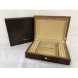 A new and boxed red Birdseye maple jewellery box by Walwood.